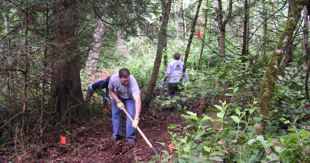 Committee members help build the Grand Ridge connector trail