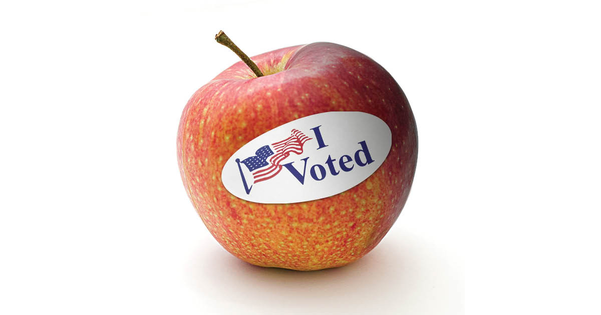 I voted sticker on an apple